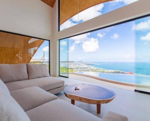 Enhancing energy flow in a modern Thailand home using SUNFLEX glass doors for a balanced Feng Shui design.