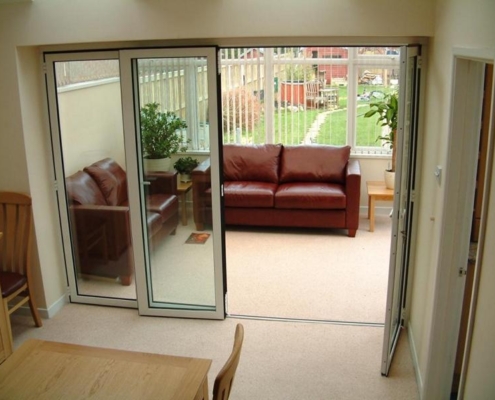 SF 45 folding door system partially opened to provide flexible ventilation for the living room.