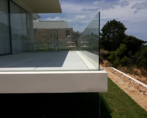 glass-balustrade-platform-perimeter-safety-barrier Glass balustrade installed on a platform edge, securing the perimeter with a clear safety glass barrier and premium view.