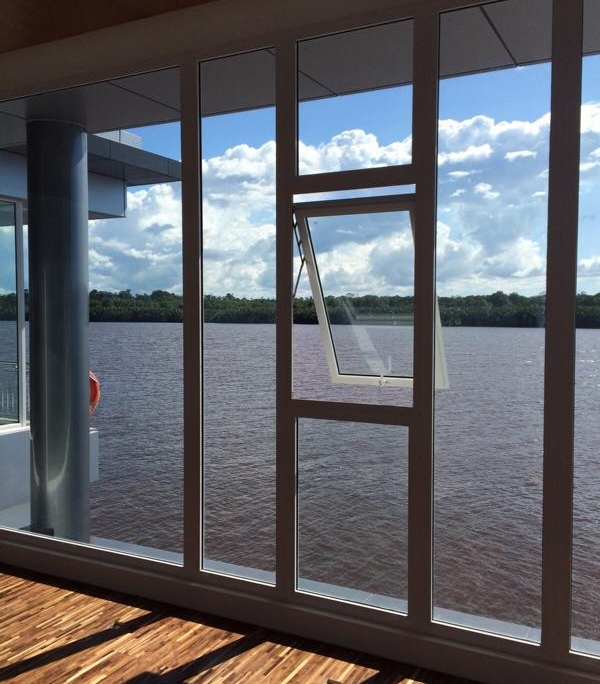 open-awning-window-aluminum-frame-sf45 Open SF 45 aluminum awning window allowing natural ventilation while protecting against light rain.