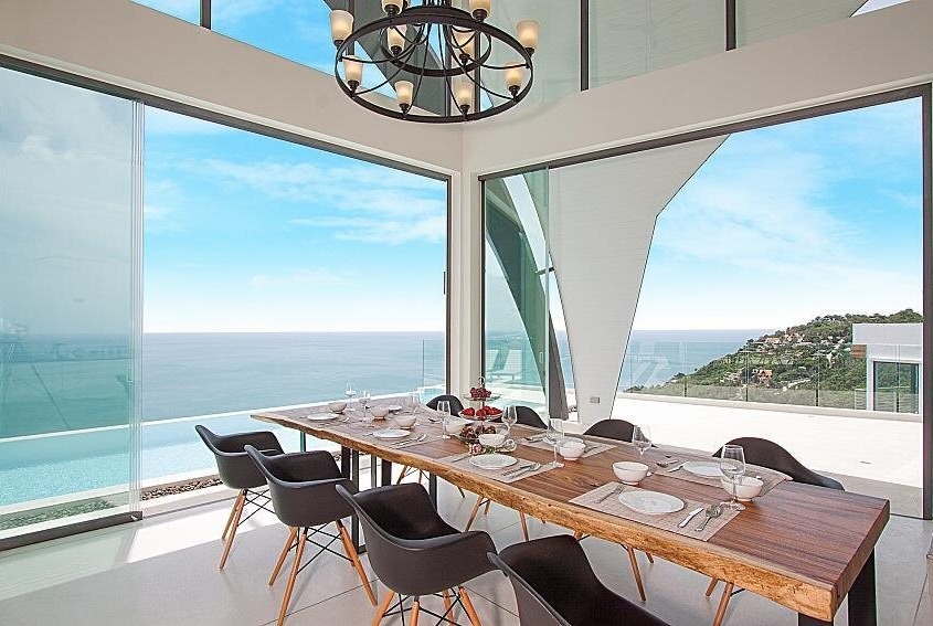 sf20-sliding-glass-system-dining-room SF 20 sliding glass system providing panoramic views from a modern dining room