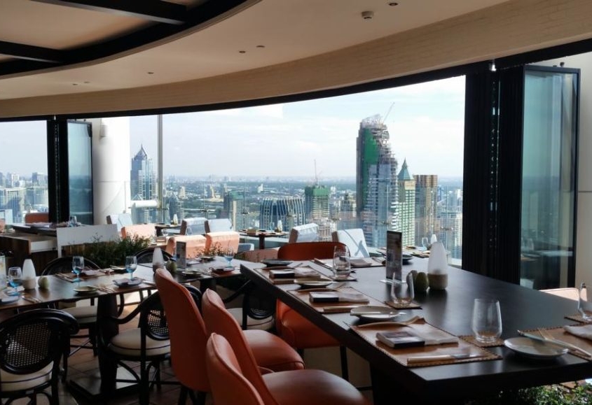 Framed SF 25 slide and turn system installed in a Bangkok skyscraper restaurant for a panoramic view.