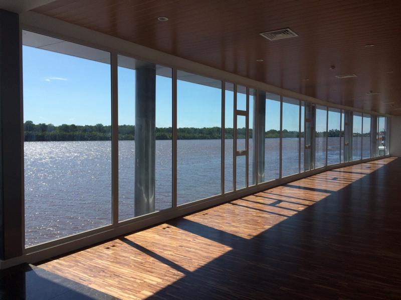 sf45-aluminum-window-system-tropical-resort SUNFLEX SF 45 aluminum window system providing seamless views and weather protection for a tropical resort.