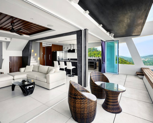 Neatly stacked aluminum panels of the SF 45 bifold door system maximizing outdoor patio space.