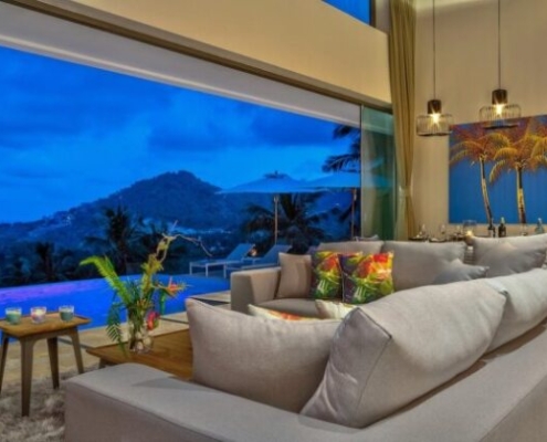 sunflex-sf20-all-glass-sliding-wall-dusk Sunflex SF 20 all-glass sliding wall in a tropical luxury villa at dusk