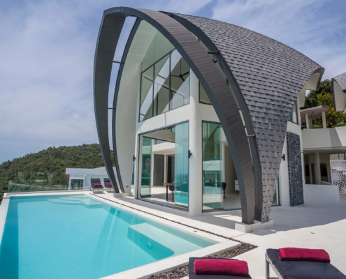 Modern luxury pool villa in Thailand featuring Sunflex premium sliding glass doors for seamless indoor-outdoor living.